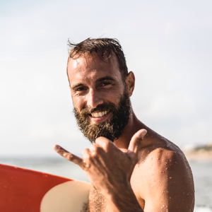 male surfer smiling
